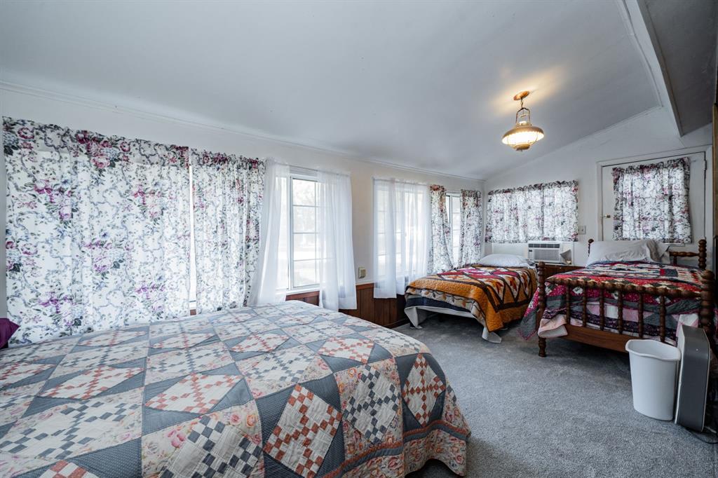 2712 Kleberg Road, Unit B Seagoville, TX 75159 - Photo 16 of 40 Carpeted bedroom featuring vaulted ceiling