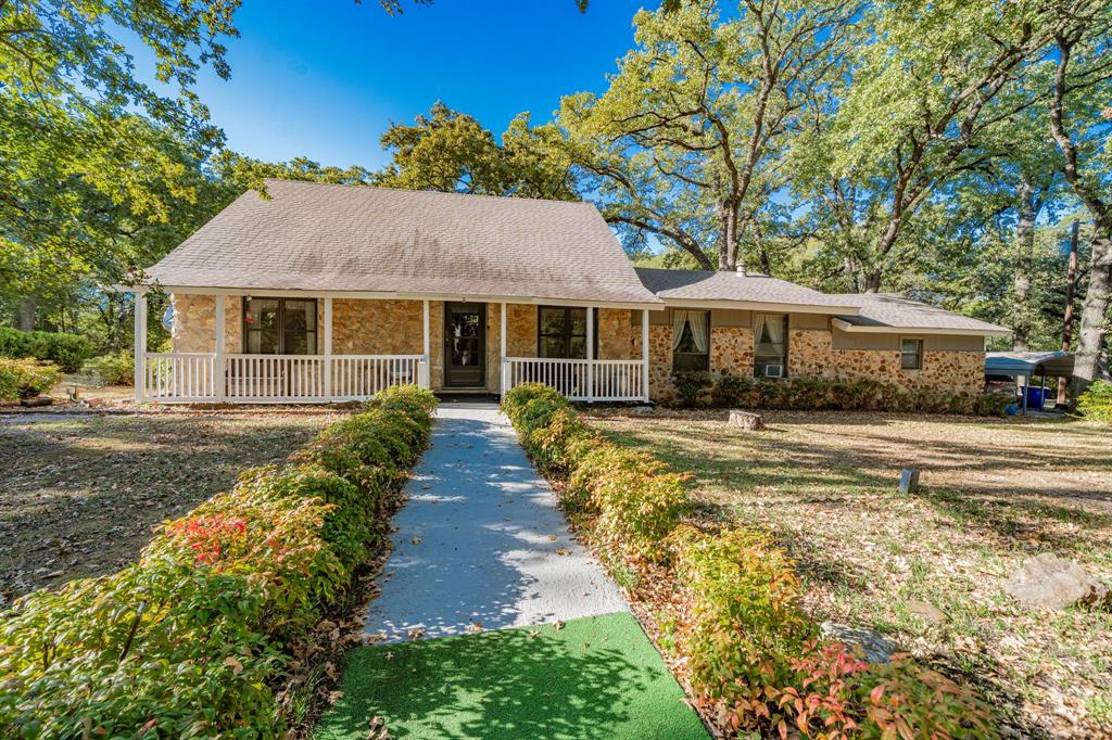 2712 Kleberg Road, Unit B Seagoville, TX 75159 - Photo 2 of 40 Ranch-style home featuring a porch, brick siding, and a shingled roof