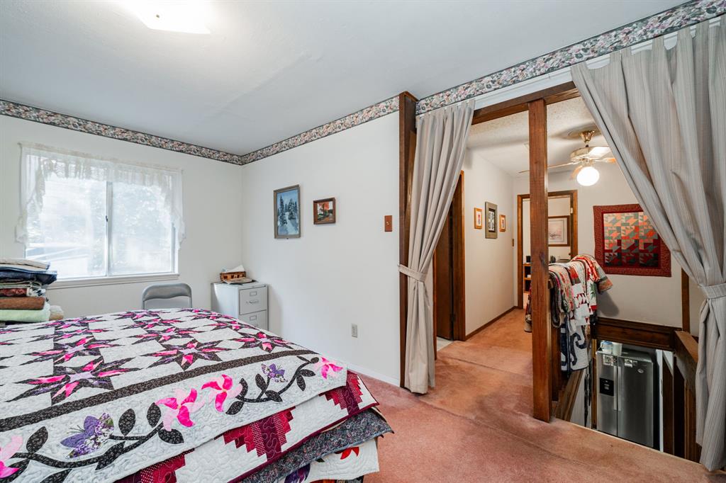 2712 Kleberg Road, Unit B Seagoville, TX 75159 - Photo 28 of 40 Bedroom featuring light colored carpet