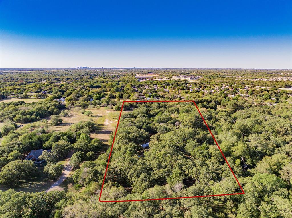 2712 Kleberg Road, Unit B Seagoville, TX 75159 - Photo 40 of 40 Aerial view of property and surrounding area featuring a heavily wooded area and property boundaries highlighted