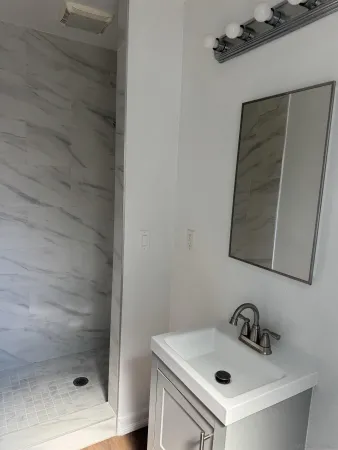 a bathroom with a sink and mirror