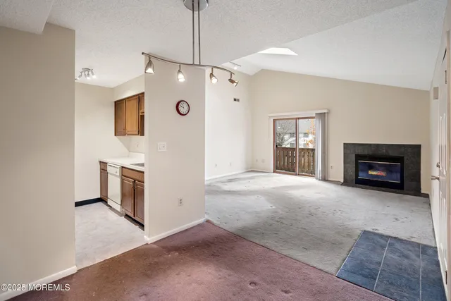 a view of a kitchen with a sink and dishwasher
