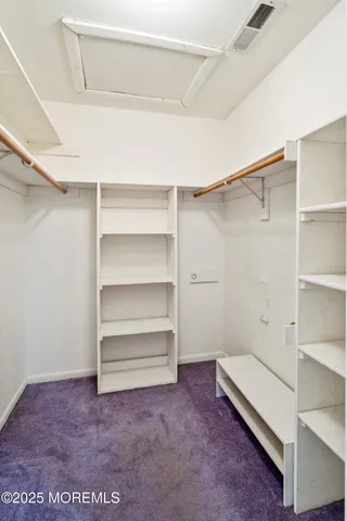 a bathroom with a sink toilet vanity and shower