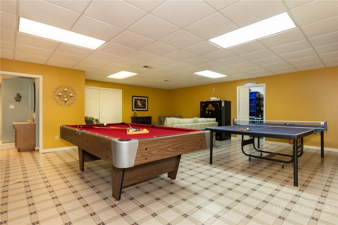1335 Shingle Gap Road Purlear, NC 28665 - Photo 29 of 49 a bed room with a table and a wall painting