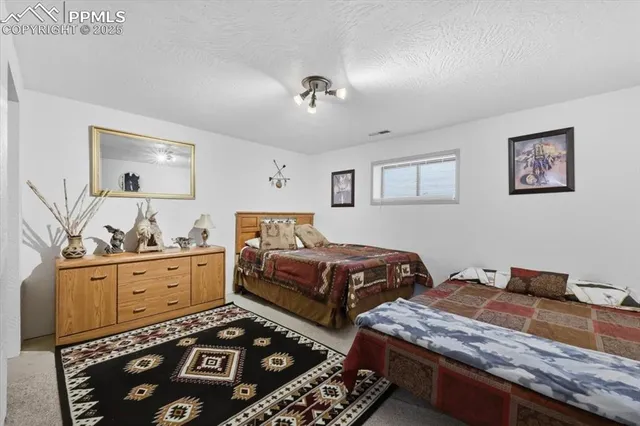 a bedroom with bed and window