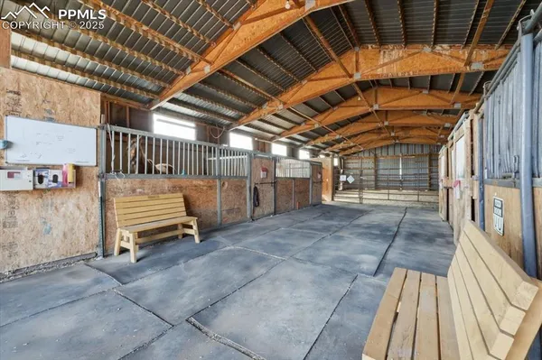 a view of a backyard with wooden fence