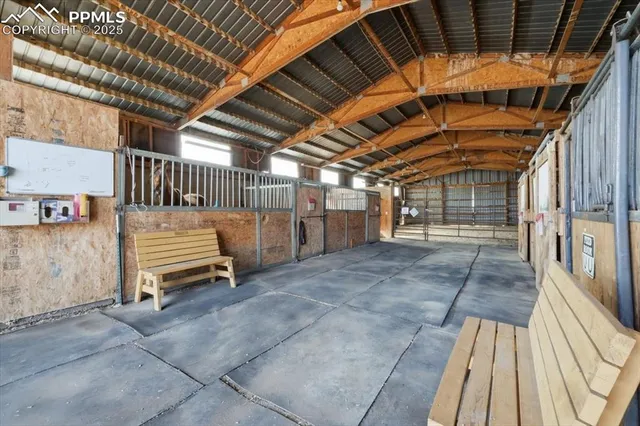 a view of a backyard with wooden fence