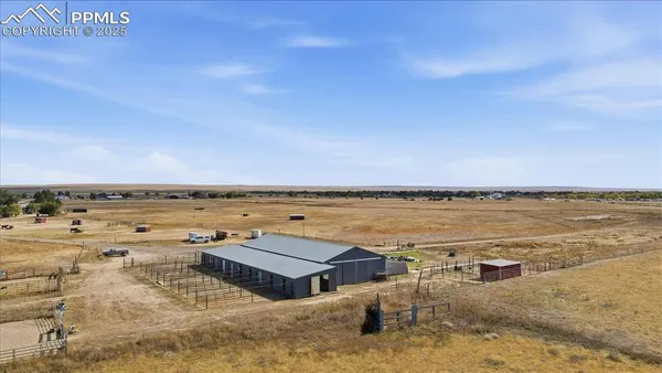 an aerial view of houses with a lake