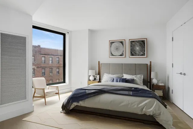 a living room with furniture a rug and white walls