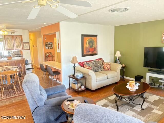 5731 West Flying M Street Tucson, AZ 85713 - Photo 8 of 20 a living room with furniture and a flat screen tv