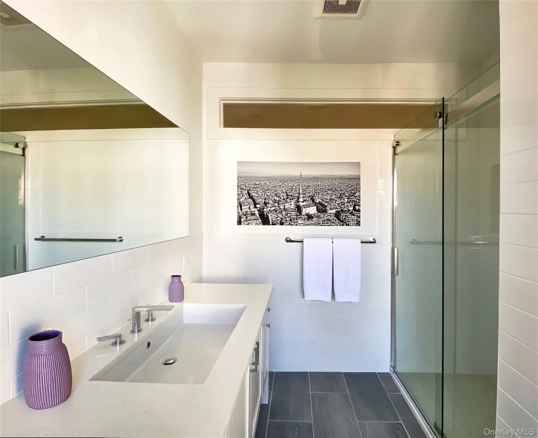 125 Warren Street Hudson, NY 12534 - Photo 18 of 25 a bathroom with a bathtub and a sink