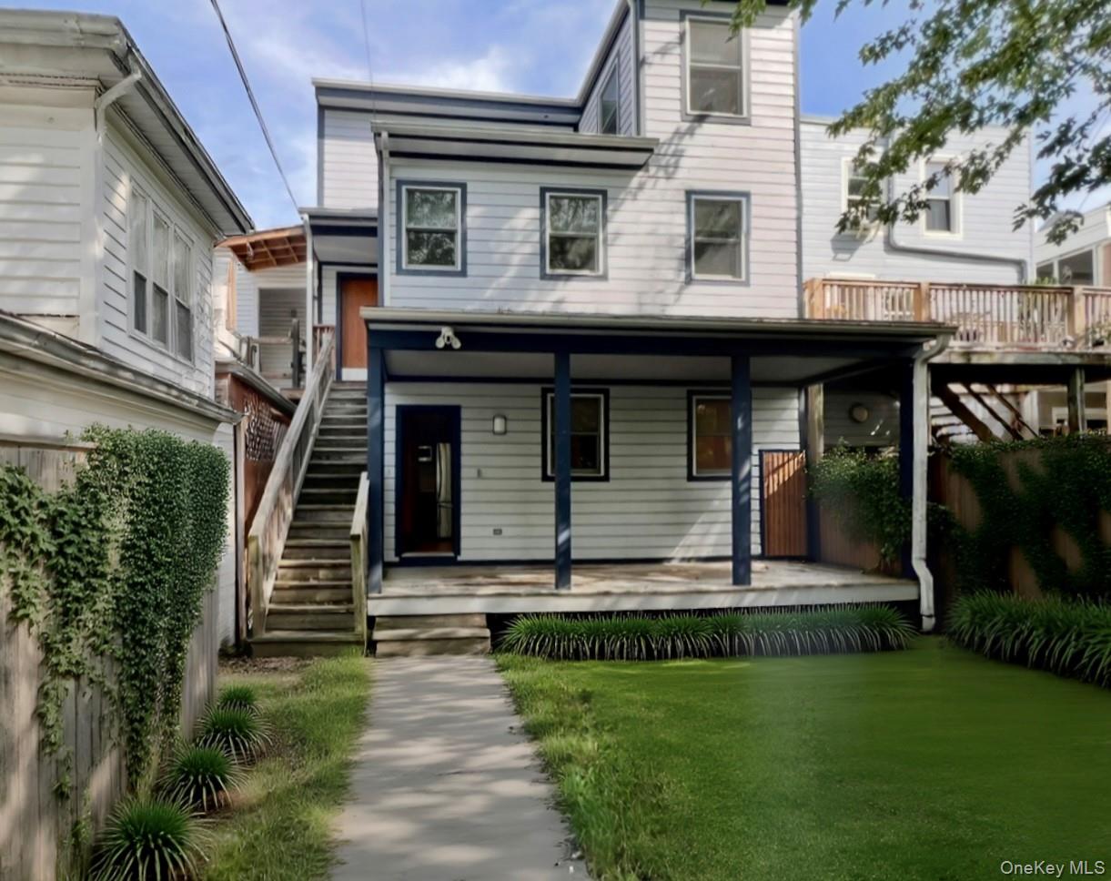 125 Warren Street Hudson, NY 12534 - Photo 22 of 25 a view of a house with backyard and garden