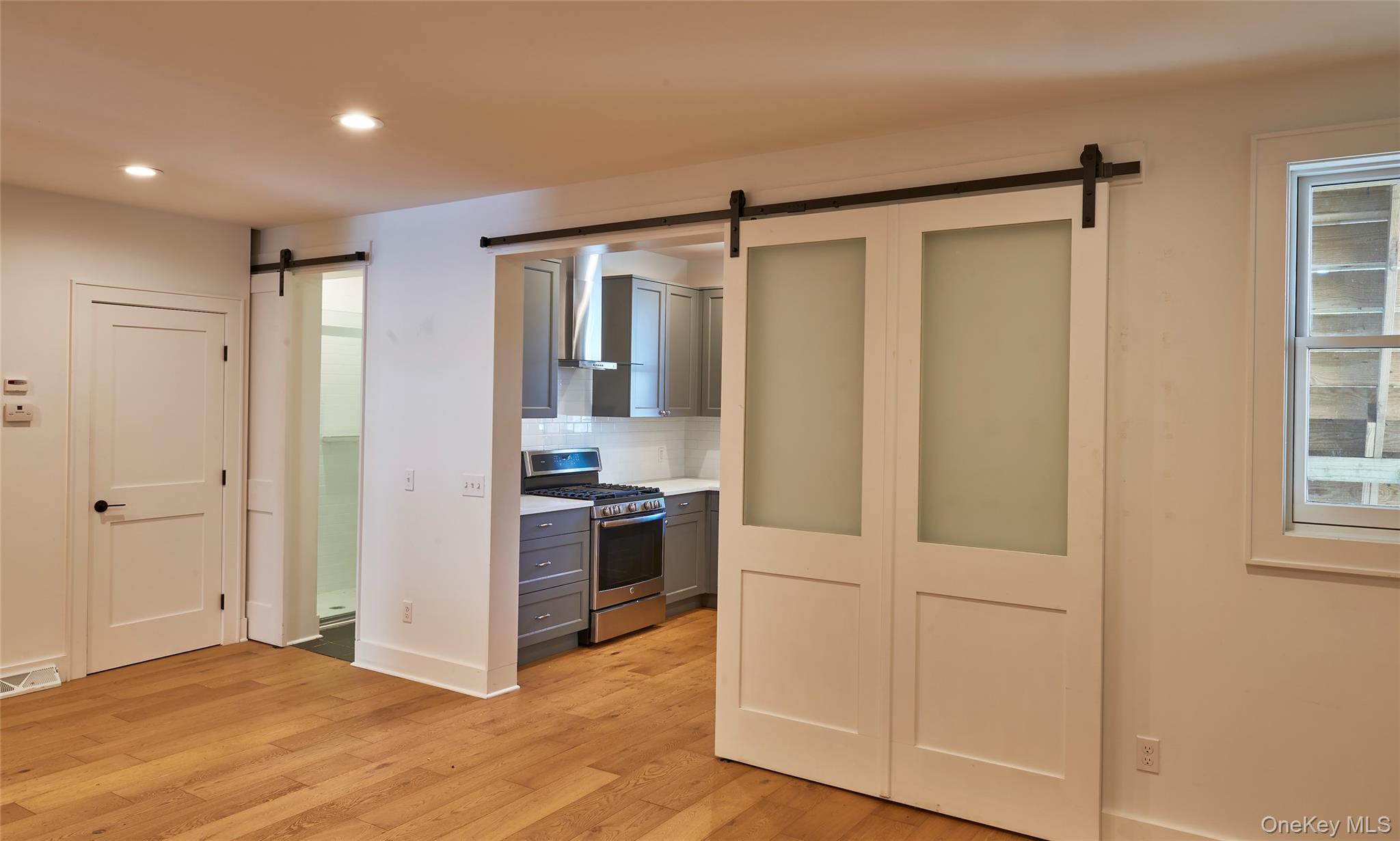125 Warren Street Hudson, NY 12534 - Photo 8 of 25 a view of kitchen with stainless steel appliances granite countertop a refrigerator and a sink