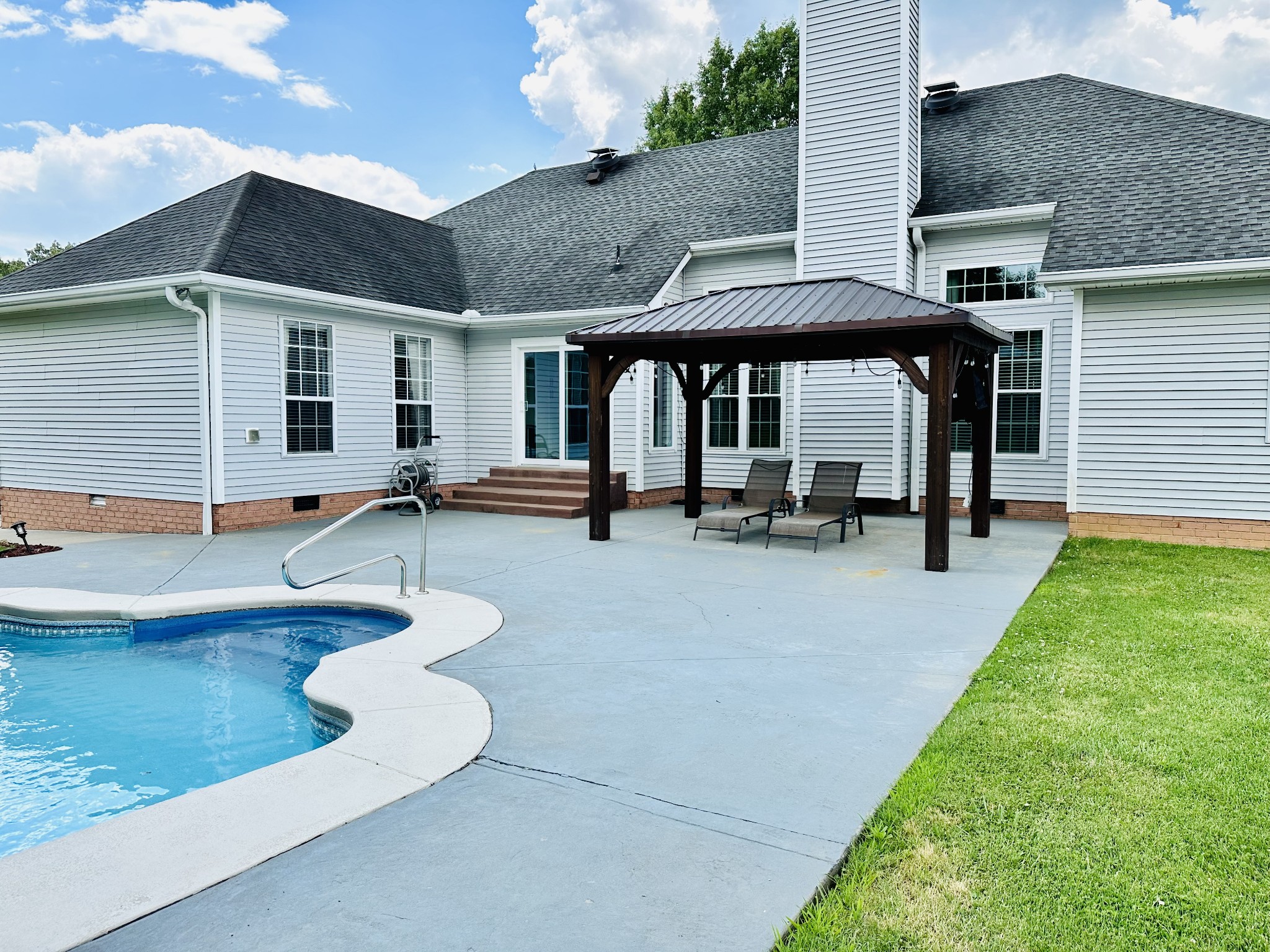 123 Biggs Road Cottontown, TN 37048 - Photo 13 of 39 a view of a house with swimming pool and sitting area