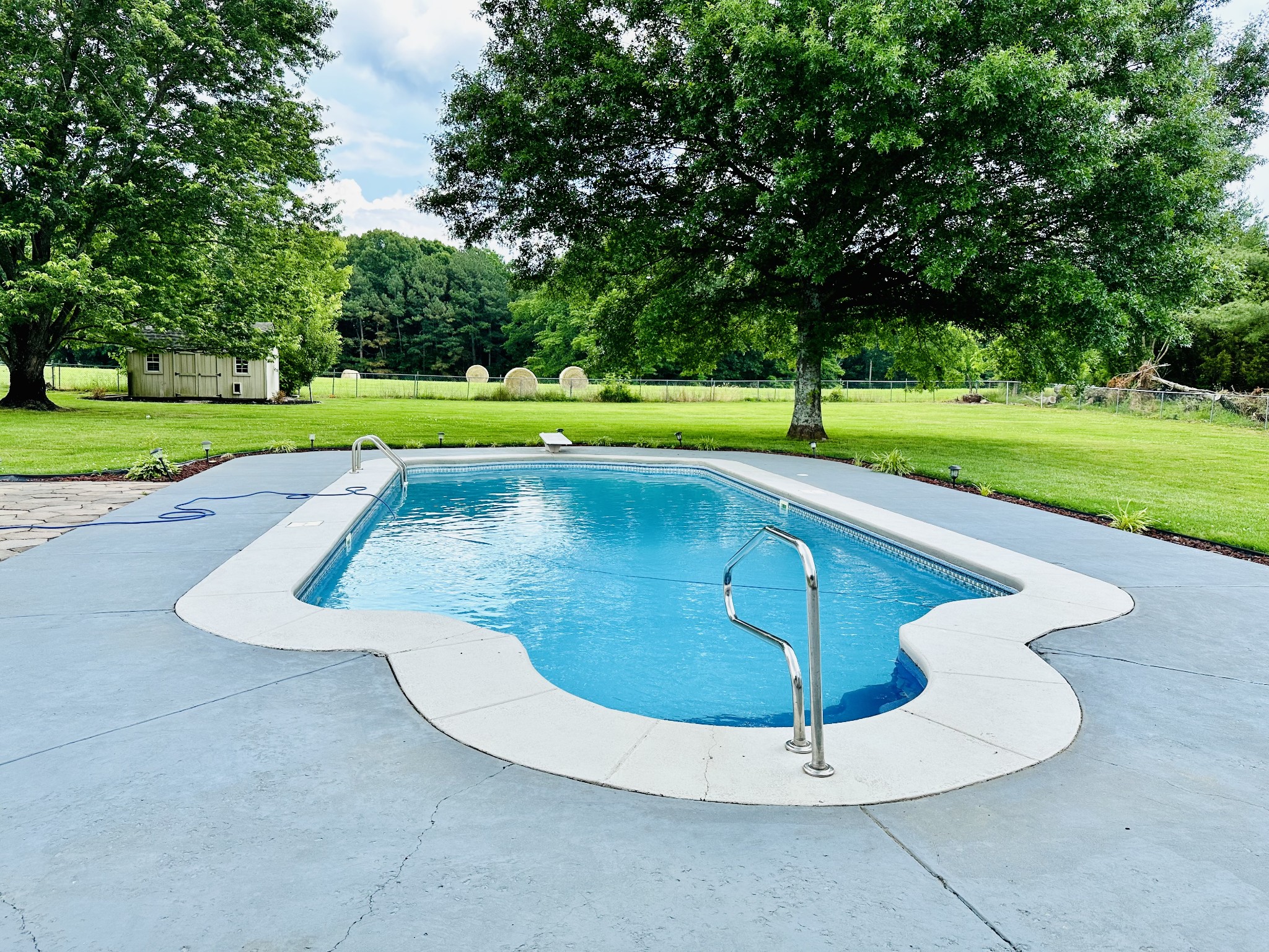 123 Biggs Road Cottontown, TN 37048 - Photo 14 of 39 a view of a swimming pool with a yard