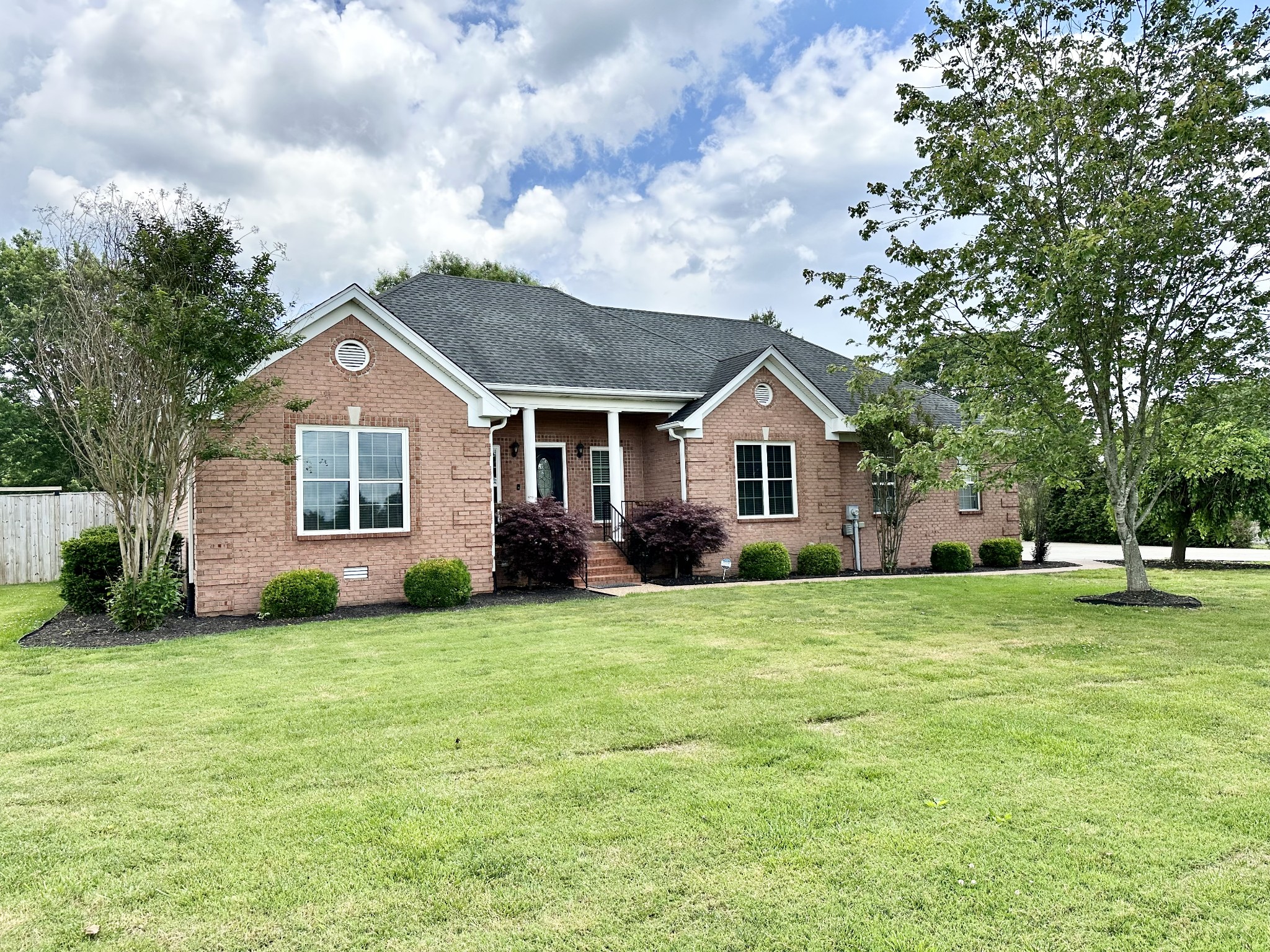 123 Biggs Road Cottontown, TN 37048 - Photo 2 of 39 a house view with a garden space