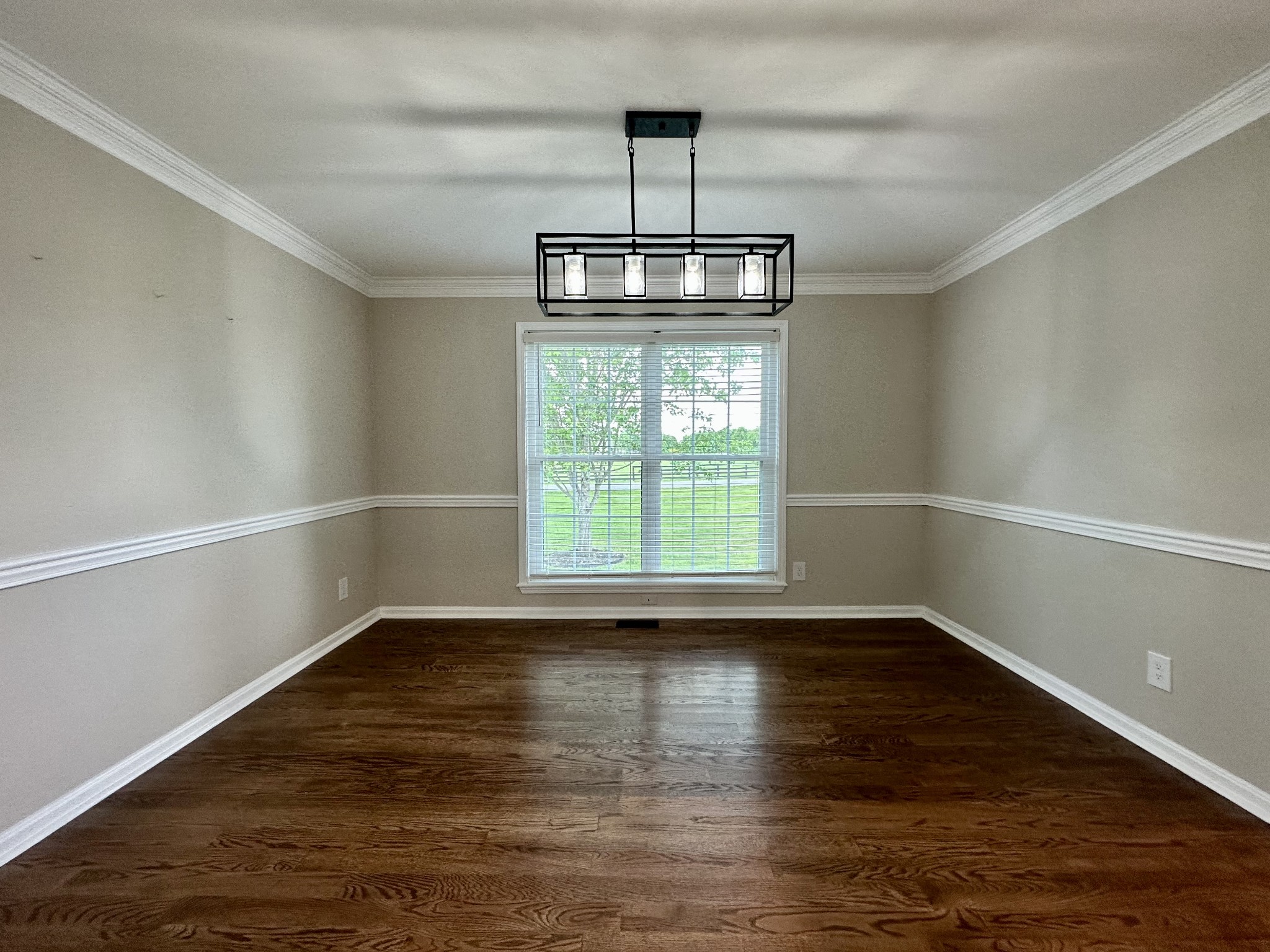 123 Biggs Road Cottontown, TN 37048 - Photo 23 of 39 a view of empty room with wooden floor and window
