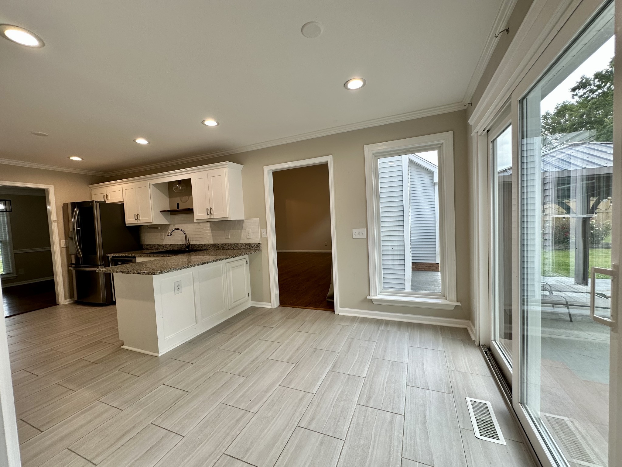 123 Biggs Road Cottontown, TN 37048 - Photo 24 of 39 a kitchen with stainless steel appliances granite countertop a stove and a refrigerator