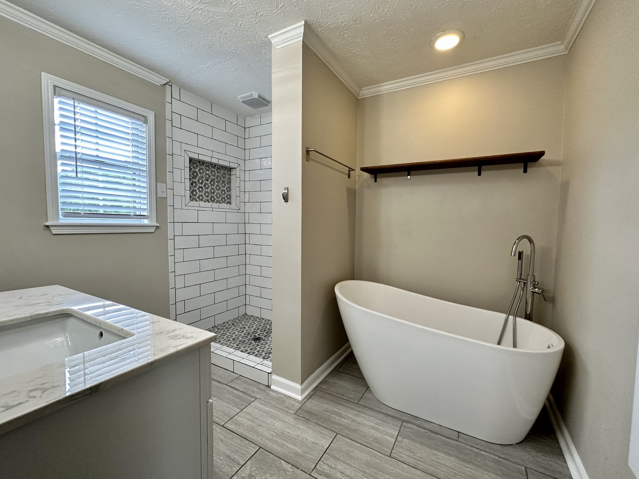 123 Biggs Road Cottontown, TN 37048 - Photo 29 of 39 a bathroom with a bathtub and a sink