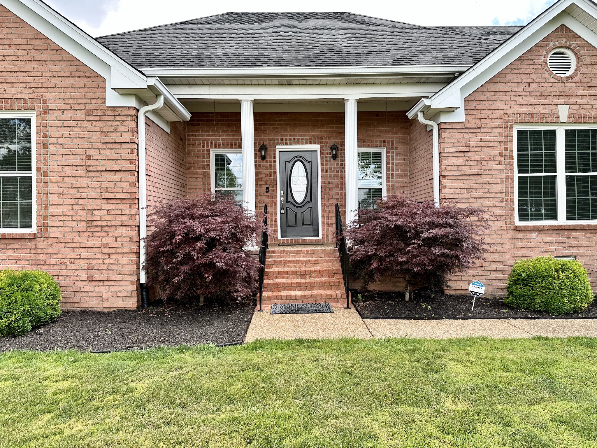 123 Biggs Road Cottontown, TN 37048 - Photo 3 of 39 a front view of a house with garden