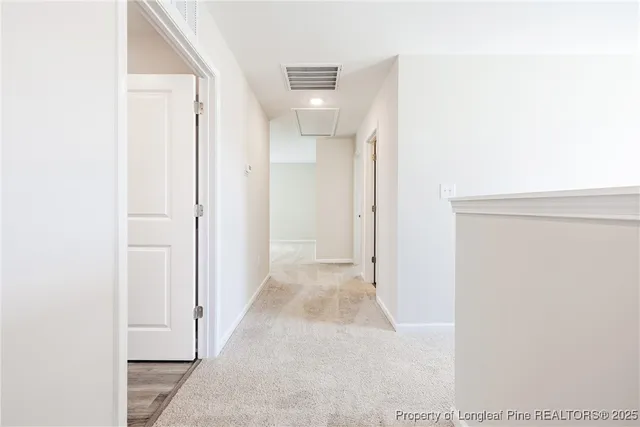 a view of a hallway with an empty room