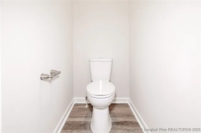 a bathroom with a toilet and a sink