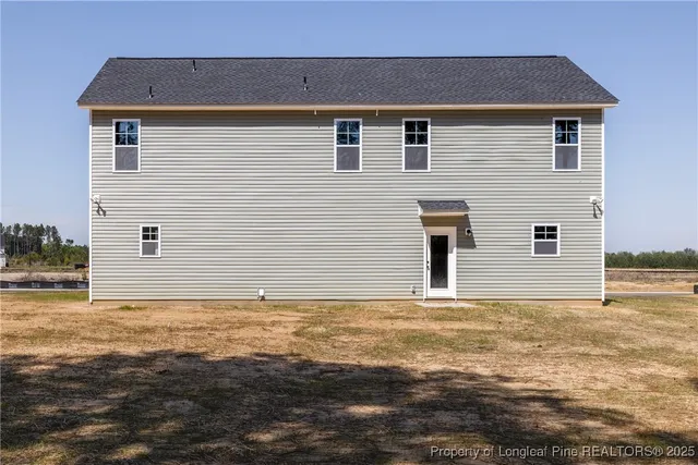 a view of a backyard of the house