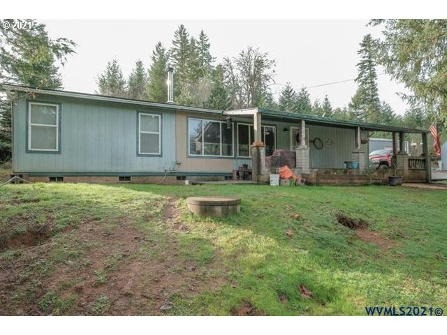32724 Old Mill Road Lebanon, OR 97355 - Photo 1 of 32 a front view of house with yard and green space