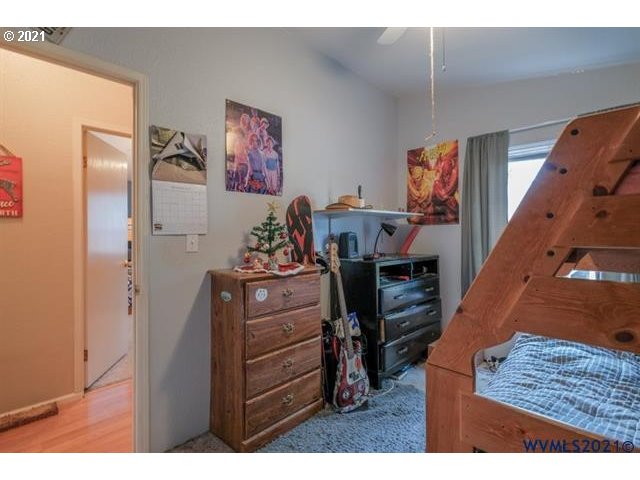 32724 Old Mill Road Lebanon, OR 97355 - Photo 13 of 32 a bed room with a bed and a television