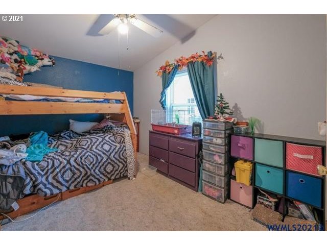 32724 Old Mill Road Lebanon, OR 97355 - Photo 15 of 32 a bedroom with furniture and a bed