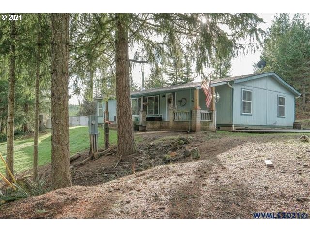 32724 Old Mill Road Lebanon, OR 97355 - Photo 19 of 32 a backyard of a house with lots of green space