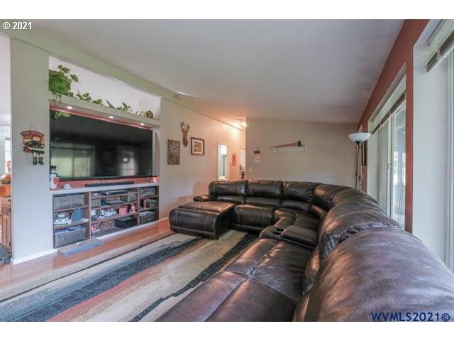 32724 Old Mill Road Lebanon, OR 97355 - Photo 3 of 32 a living room with furniture and a flat screen tv