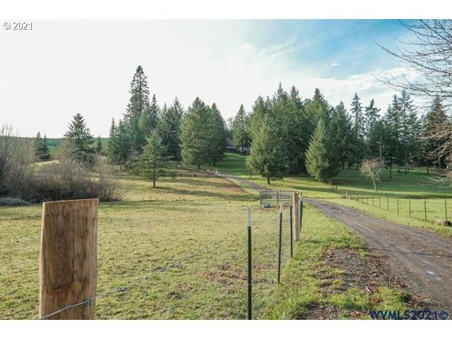 32724 Old Mill Road Lebanon, OR 97355 - Photo 27 of 32 a view of a swimming pool and a yard
