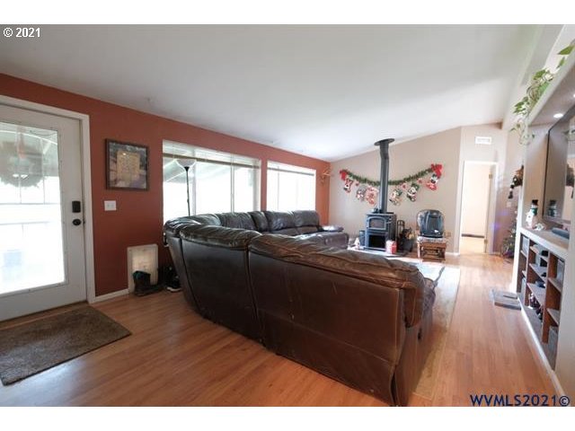 32724 Old Mill Road Lebanon, OR 97355 - Photo 31 of 32 a living room with furniture and a flat screen tv