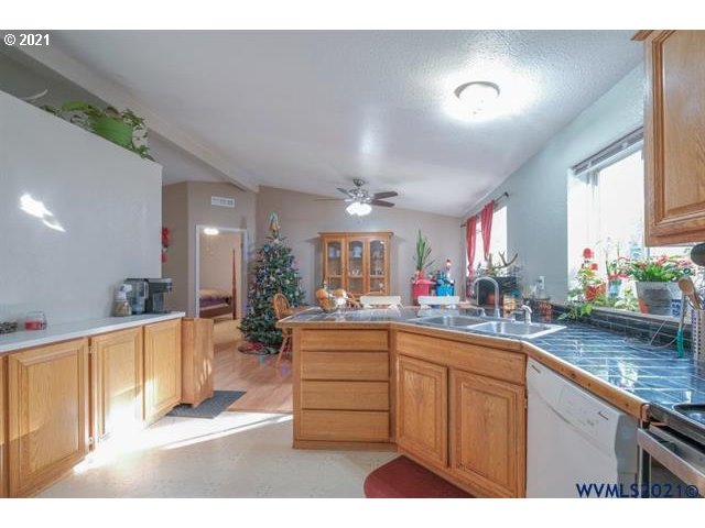 32724 Old Mill Road Lebanon, OR 97355 - Photo 5 of 32 a kitchen with lots of counter top space and living room
