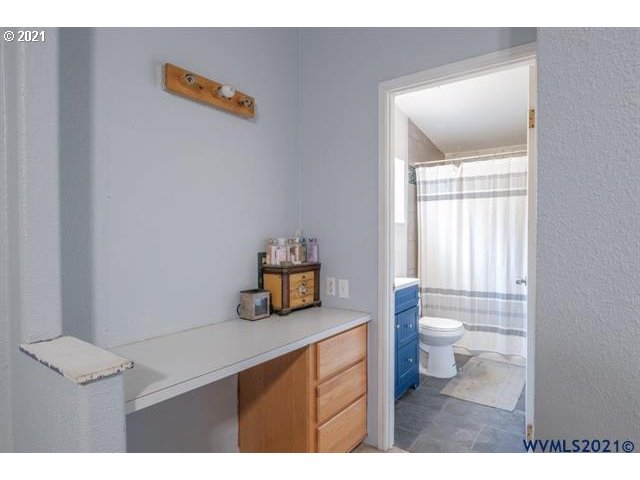 32724 Old Mill Road Lebanon, OR 97355 - Photo 10 of 32 a bathroom with a sink a toilet and a window