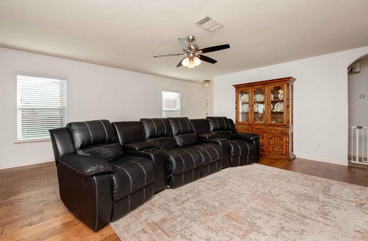 216 Millers Loop Jarrell, TX 76537 - Photo 6 of 31 Living area featuring hard wood flooring, ceiling fan, and arched walkways