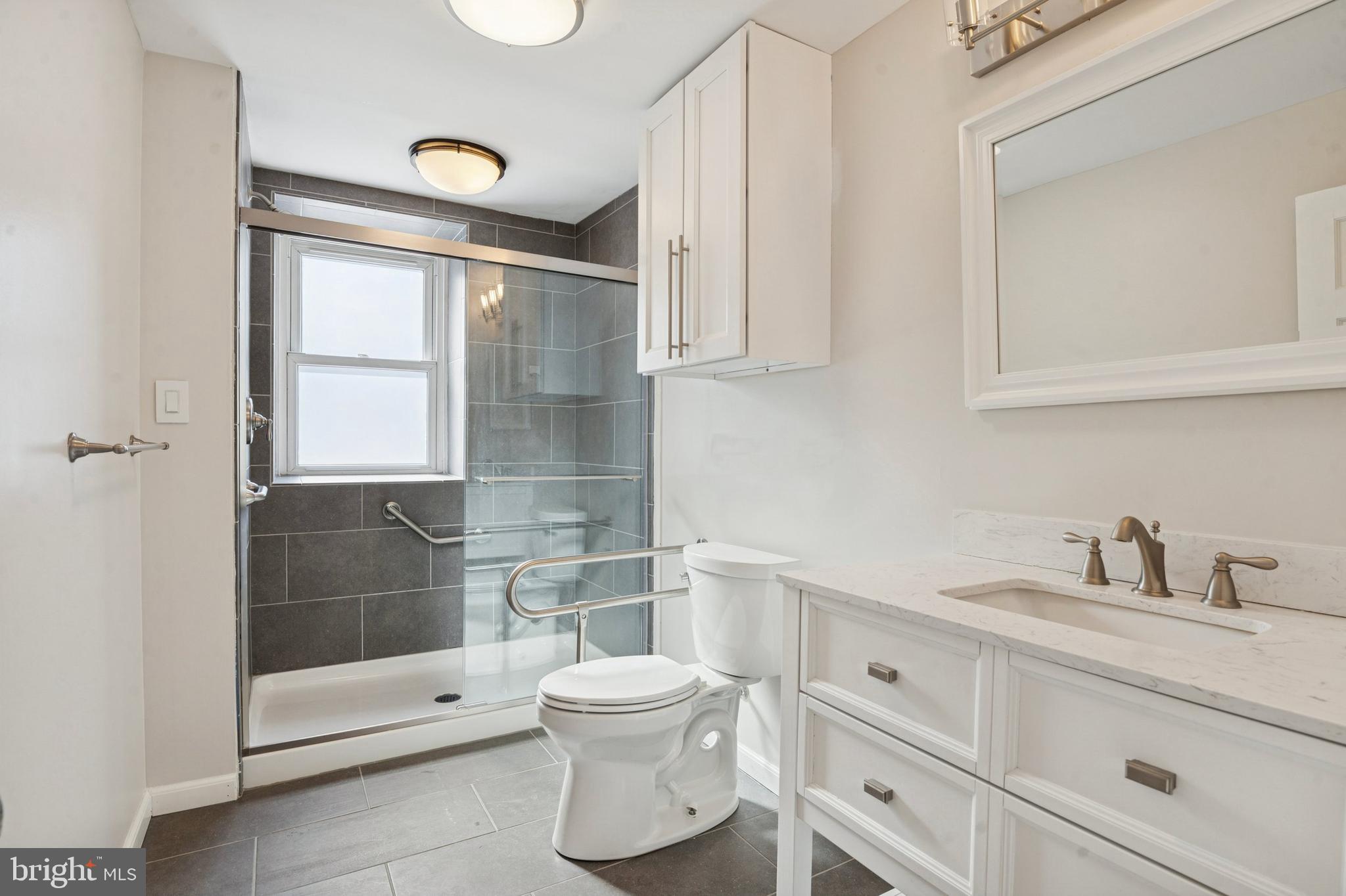 3 South Brandywine Avenue, Unit 1 Modena, PA 19320 - Photo 21 of 27 a bathroom with a toilet a sink and shower