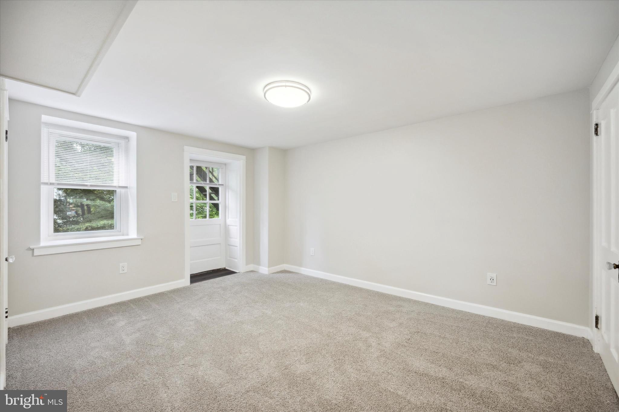 3 South Brandywine Avenue, Unit 1 Modena, PA 19320 - Photo 22 of 27 an empty room with windows