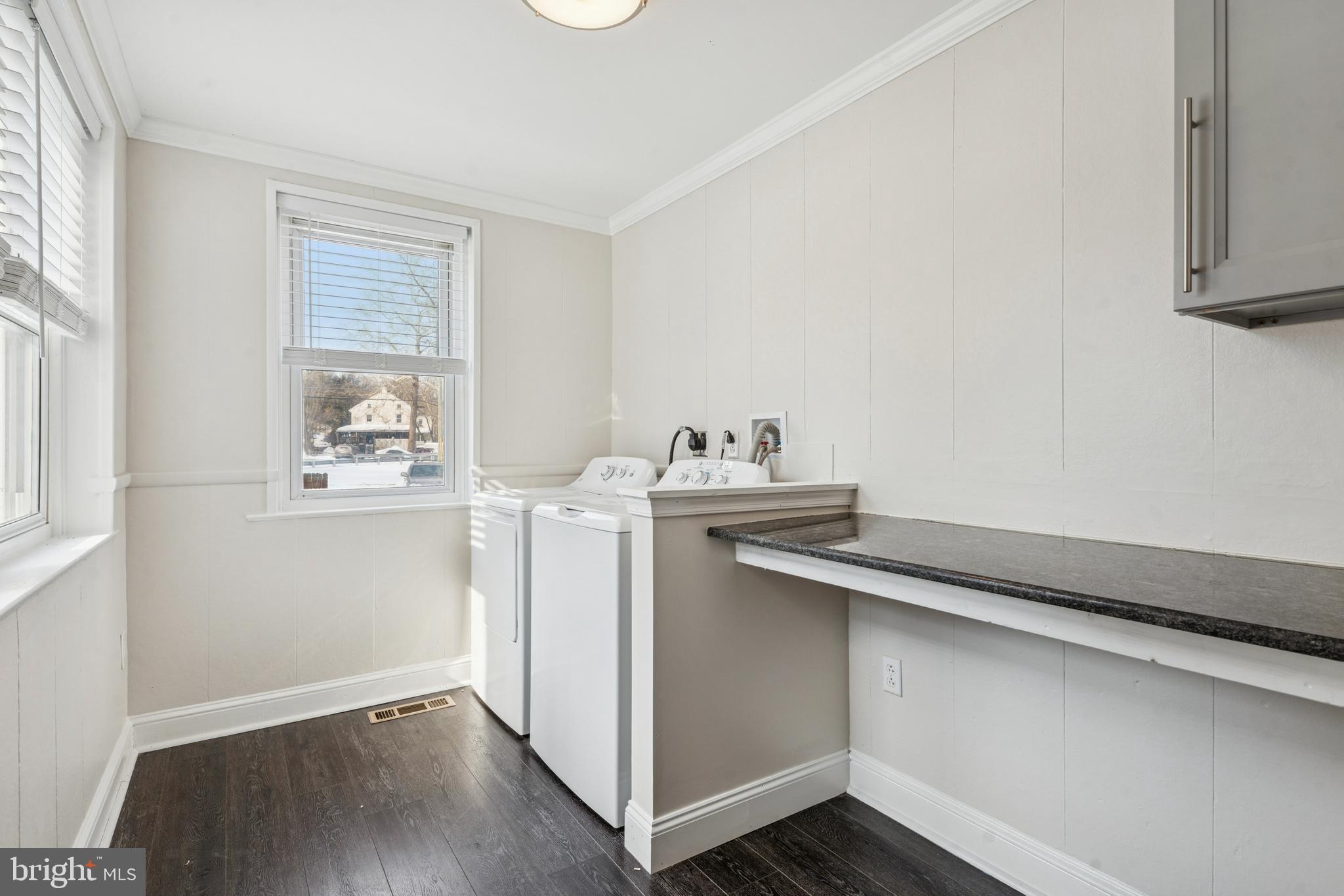 3 South Brandywine Avenue, Unit 1 Modena, PA 19320 - Photo 26 of 27 a utility room with cabinets washer and dryer