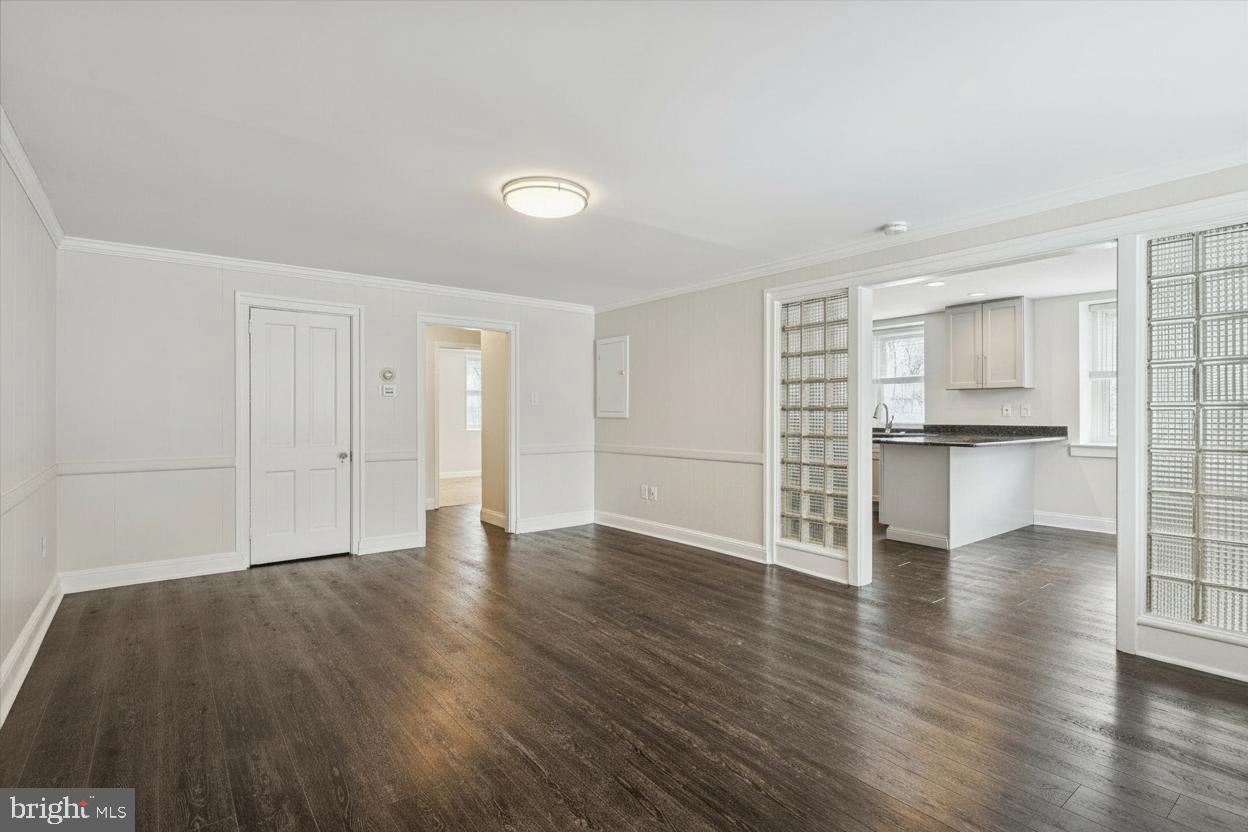 3 South Brandywine Avenue, Unit 1 Modena, PA 19320 - Photo 4 of 27 a view of empty room with wooden floor and kitchen