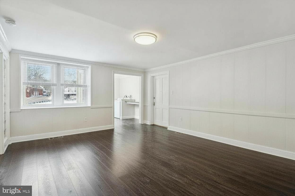 3 South Brandywine Avenue, Unit 1 Modena, PA 19320 - Photo 10 of 27 an empty room with wooden floor and windows