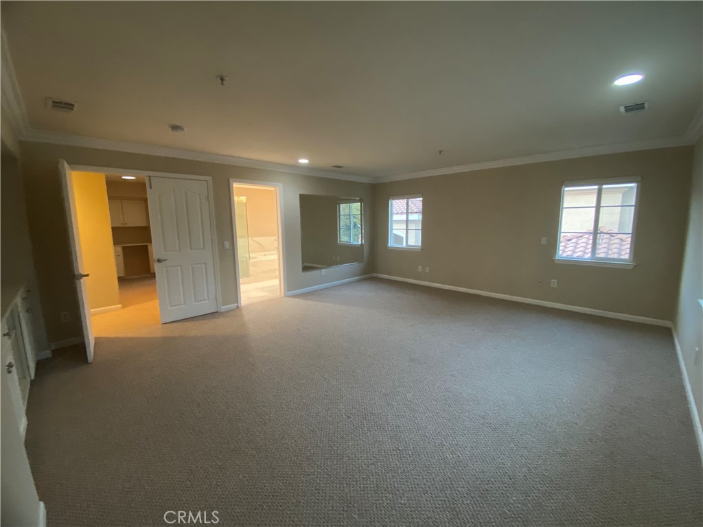 721 South 3rd Avenue, Unit A Arcadia, CA 91006 - Photo 11 of 16 an empty room with a empty space and windows