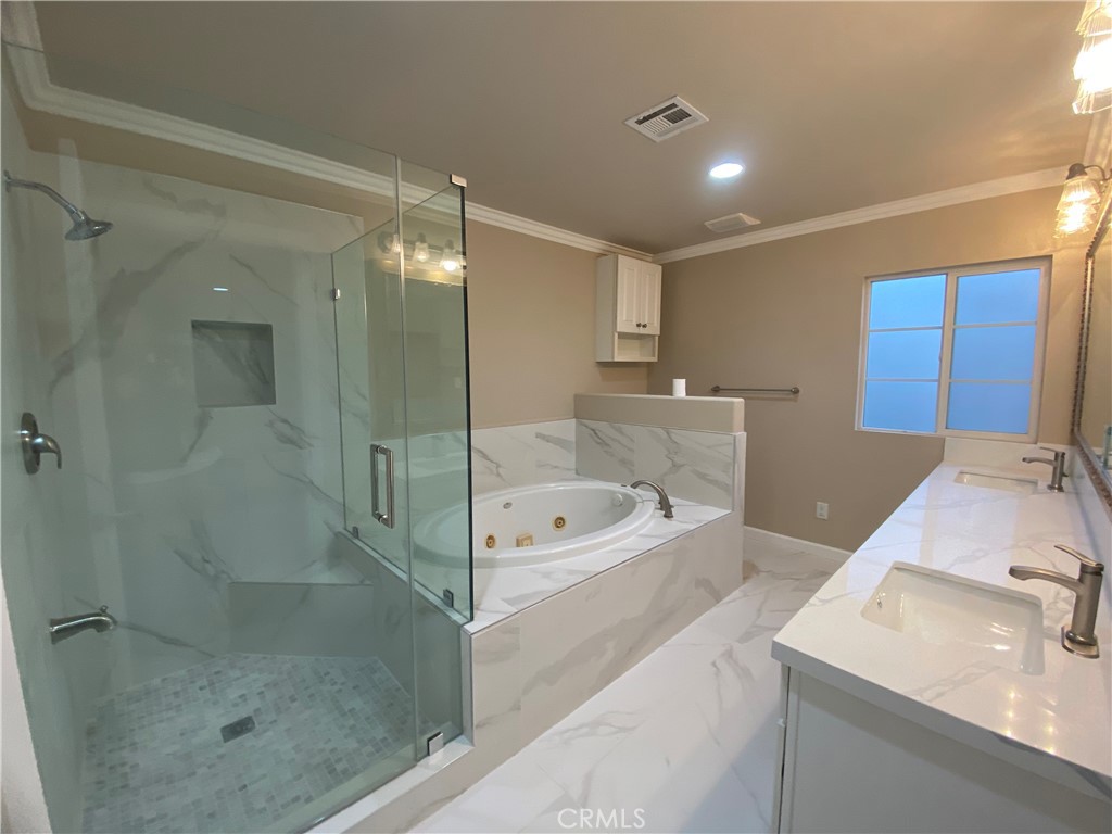 721 South 3rd Avenue, Unit A Arcadia, CA 91006 - Photo 12 of 16 a bathroom with a tub sink shower and mirror