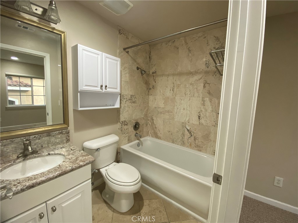721 South 3rd Avenue, Unit A Arcadia, CA 91006 - Photo 14 of 16 a bathroom with a granite countertop toilet a sink and a bathtub