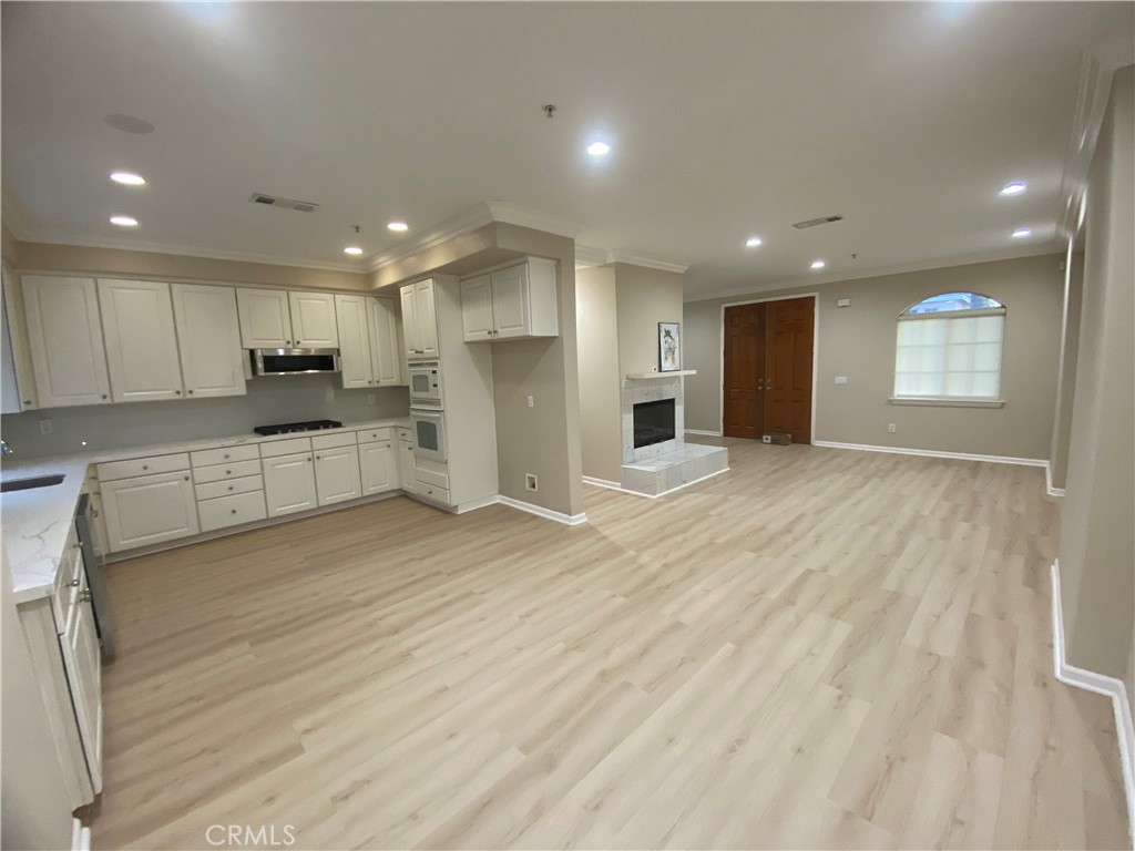 721 South 3rd Avenue, Unit A Arcadia, CA 91006 - Photo 4 of 16 a view of a kitchen with a sink and a refrigerator