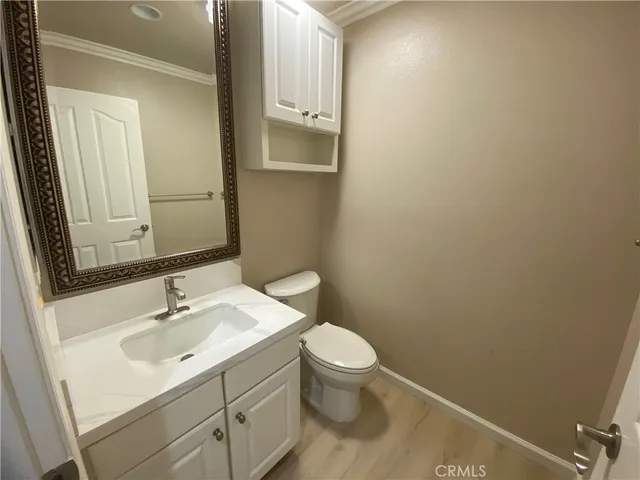 a bathroom with a sink toilet and vanity
