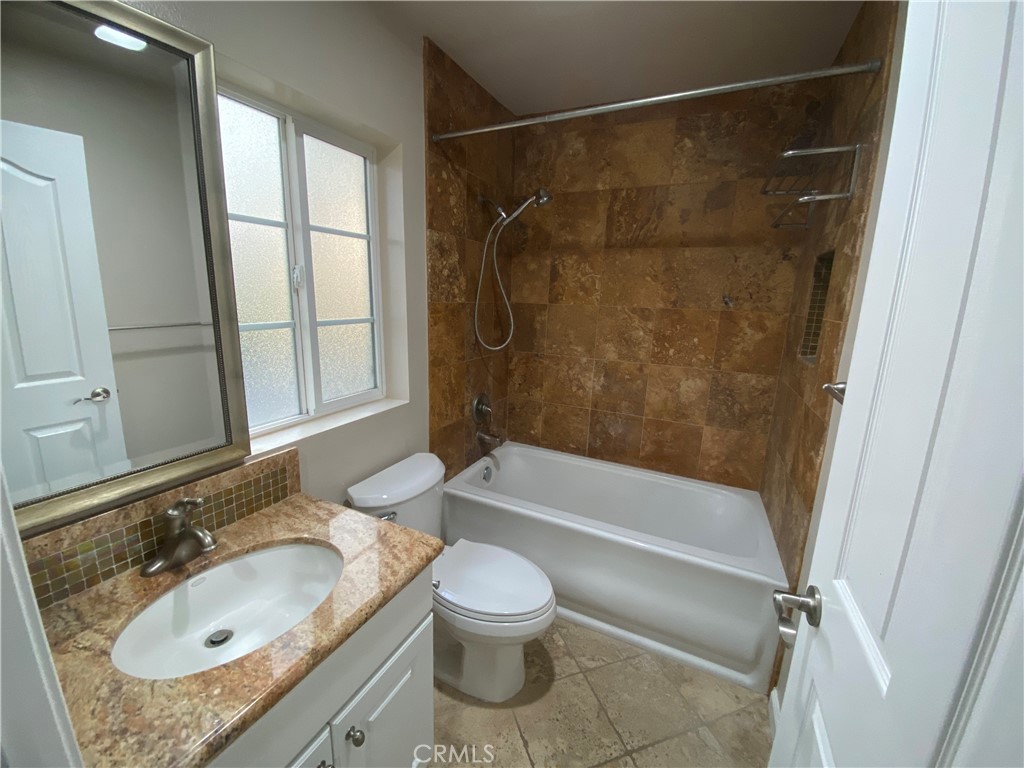 721 South 3rd Avenue, Unit A Arcadia, CA 91006 - Photo 9 of 16 a bathroom with a granite countertop sink toilet and shower