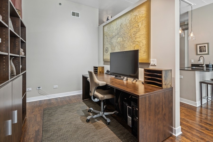 910 West Madison Street, Unit 602 Chicago, IL 60607 - Photo 10 of 15 a view of a workspace with furniture and a window