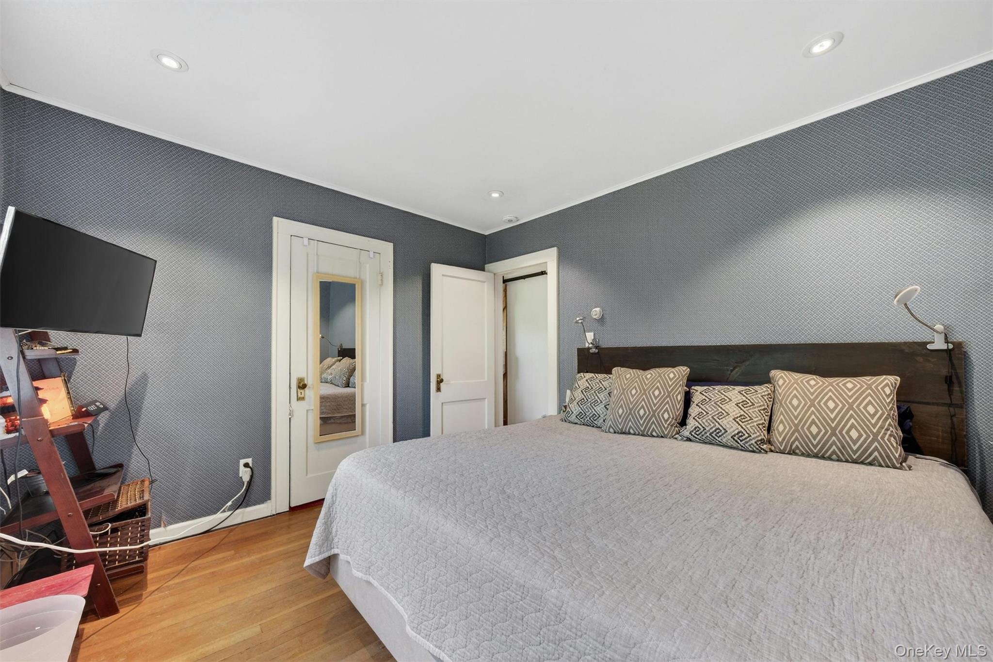 10 Edwin Road Poughkeepsie, NY 12603 - Photo 21 of 46 a bedroom with a bed and a flat screen tv